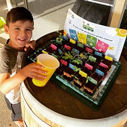Child planting Discovery Garden plants